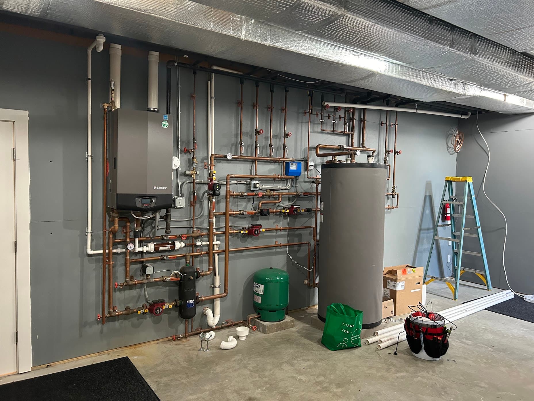 A Lochinvar boiler and indirect water heater installed with copper piping