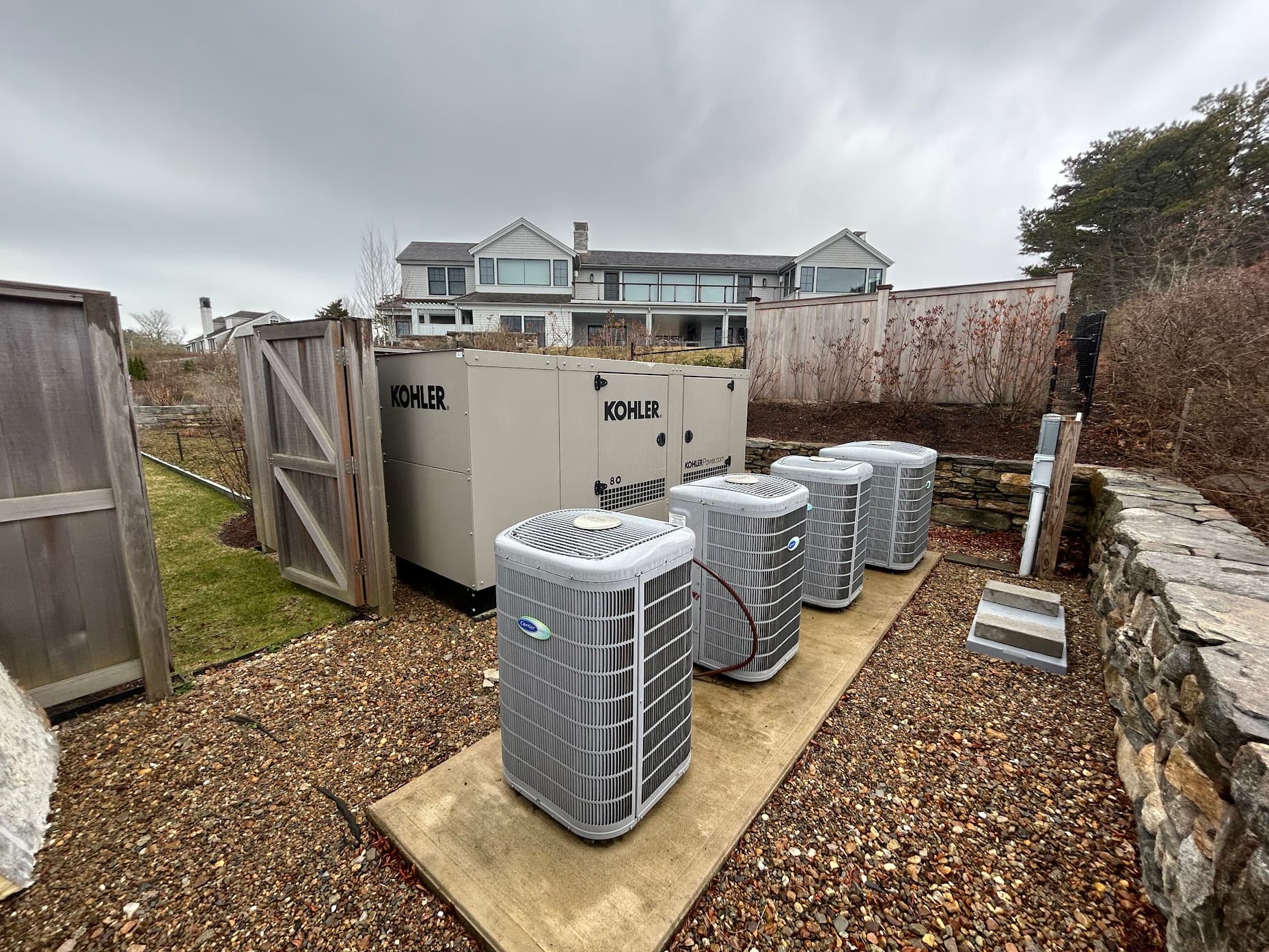 A recent East Coast Mechanical install: central AC condensers and a backup generator at a South Shore home
